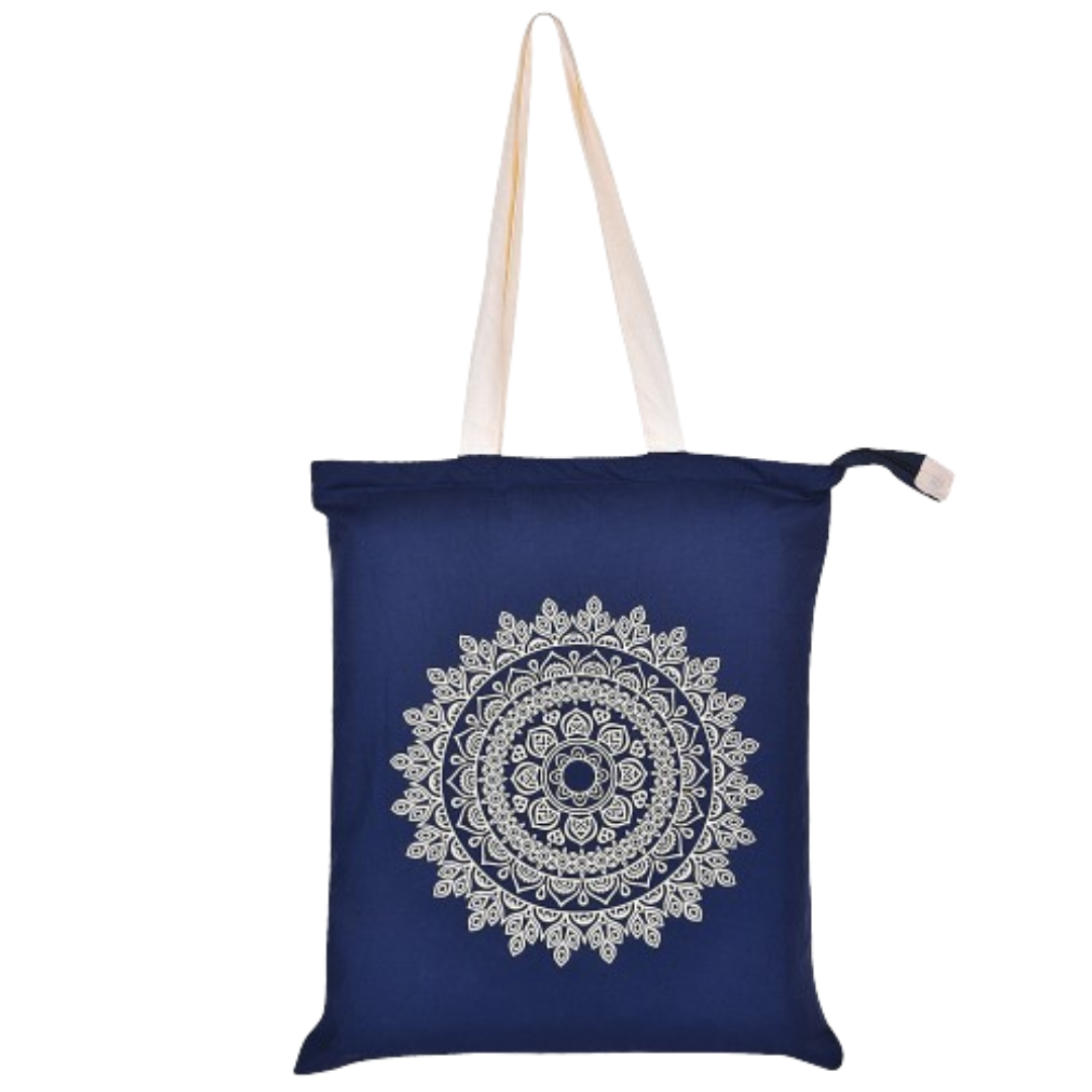 Navy blue tote bag with a white mandala design on a white background